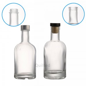 750 ml clear and black glass liquor bottle